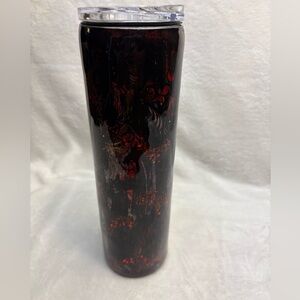 Stylish tumbler featuring a red and black 
with spider and web designs.
